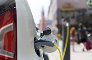 A photo of an electric vehicle being charged. 